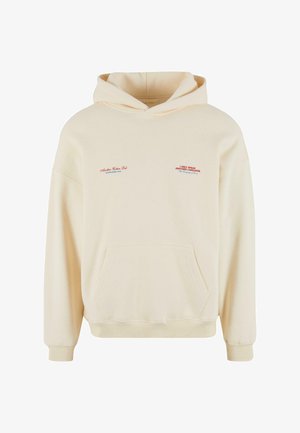 Krémová mikina s kapucňou vyrobená z mäkkej látky s prednou kapsou. Obsahuje modré a červené texty na hrudi a na ľavom rukáve.