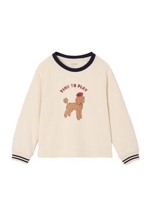 Cremefarbenes Sweatshirt mit navyfarbenem Kragen und Bündchen. Verziert mit einem Cartoon-Pudel, der eine rote Baskenmütze trägt, und dem Text "ZEIT ZU SPIELEN" in rot.