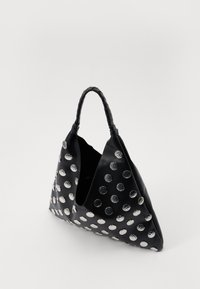 Black leather handbag with a triangular shape, featuring metallic silver polka dots and a textured, braided handle.