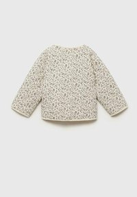 Weiß gesteppter Oberteil mit langen Ärmeln, verfügt über kleine dunkle Blumenmuster, runder Halsausschnitt und einen strukturierten Stoff. Ränder in Creme gesäumt.