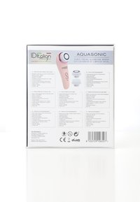Ensemble de brosse de nettoyage facial sonique Aquasonic avec deux têtes de brosse et instructions multilingues sur l'emballage.