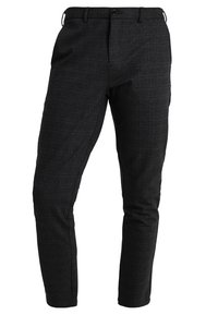 Zwarte, gestructureerde broek met een slim fit. Heeft een standaard tailleband met riemlussen en een enkele knoopsluiting. Klassiek ontwerp.