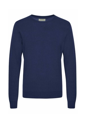 Tummansininen pitkähihainen neulepaita pehmeästä, tekstuuriltaan mielenkiintoisesta kankaasta, pyöreällä kaula-aukolla ja resorikäsivarsilla sekä -helmalla. Minimalistinen muotoilu, ei kuvioita.