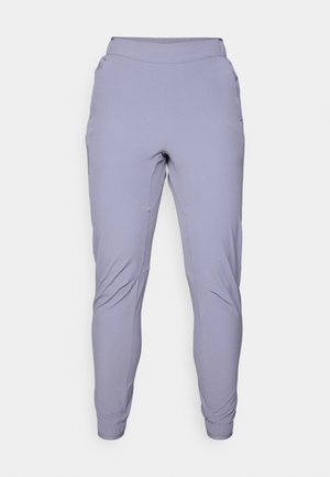 Helle lila Jogginghosen mit elastischem Bund, seitlichen Taschen, schmal zulaufenden Beinen und einer glatten, dehnbaren Stoffstruktur.