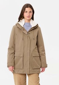 Lichtbruine, gewatteerde jas met capuchon en een zachte, witte fleece voering, twee voorzakken en verstelbare trekkoorden. Gladde buitenkant.