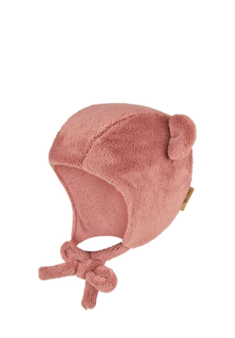 Pink fleece hat with bear ears, knot ties, and soft texture. Features rounded shape and a tag on one side for brand identification.