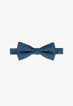 Blue patterned bow tie made of fabric, featuring circular designs in lighter blue and a smooth texture. Adjustable strap for fitting.