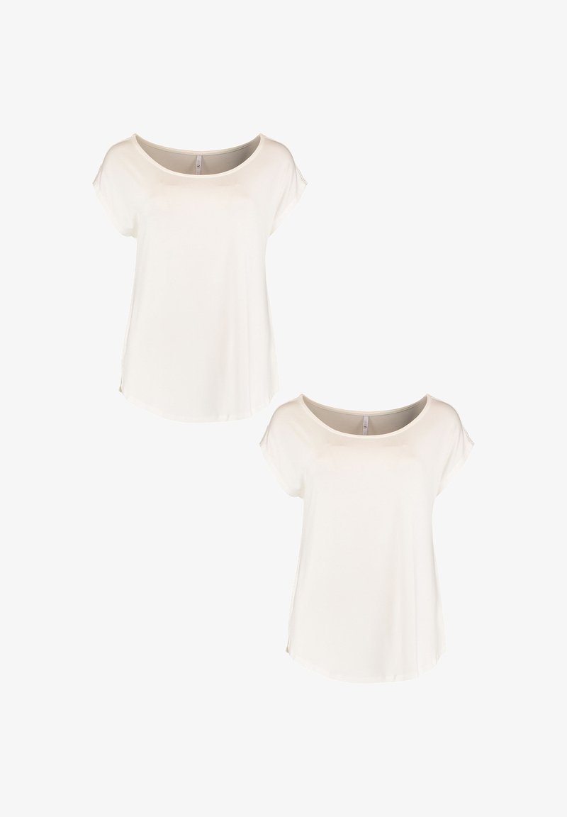 White short-sleeve t-shirts with a wide neck, soft fabric, relaxed fit, and side slits at the hem. Two shirts displayed together.