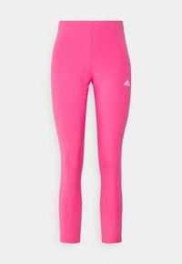 Rosa leggings tillverkade av stretchigt material. Har en figurnära design med hög midja och en liten vit Adidas-logotyp på nedre vänstra sidan.
