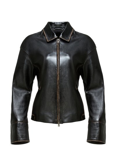 Black leather jacket with a zip front, pointed collar, and wide sleeves. Features contrasting brown stitching and a smooth texture.