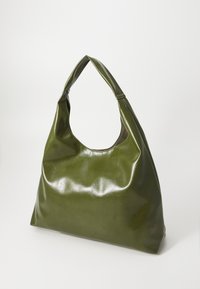 Glossy olive green handbag with a curved top handle, large main compartment, and soft, smooth texture. Features a rounded silhouette.