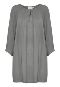 Túnica de corte holgado y de manga larga en suave tejido gris, con un pliegue en la parte frontal, escote redondo y un detalle de ojal en el cuello.