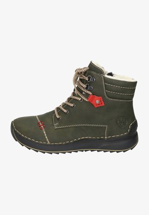 Olive green leather ankle boots with brown laces, faux fur lining, red accent, and rubber sole featuring textured tread for grip.