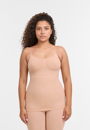 Naakte naadloze tanktop met dunne bandjes, slim-fit ontwerp, zachte textuur en een gladde afwerking. Geschikt om te lagen of als loungewear.