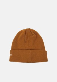 Brown knitted beanie with a folded cuff, featuring a simple white logo on the side. Soft texture, rounded top, and snug fit.
