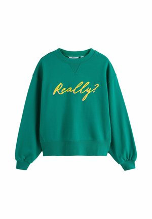 Turbia bluza crewneck z ribbowanym wykończeniem rękawów i dolnej części, z napisem "Naprawdę?" w żółtej i różowej czcionce na klatce piersiowej.