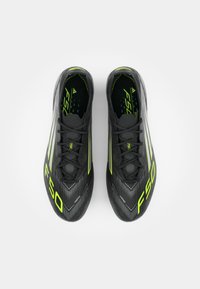 adidas Performance F50 ELITE SG - Soft-ground football boots - core black/iron metallic/lucid lemon