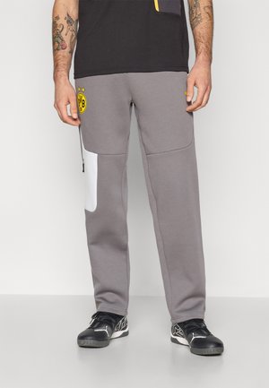 Grå sweatpants med hvid paneldetalje, elastisk talje og logo-patch. Har en slank pasform og blødt stof for komfort.