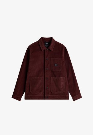 Giacca in velluto a coste color bordeaux con colletto, chiusura frontale con bottoni e due tasche applicate; presenta una piccola etichetta con logo sulla tasca del petto.