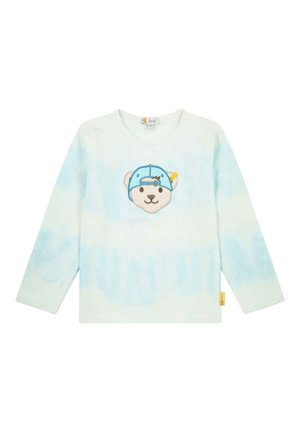 Camisa de manga larga en tie-dye azul claro, con una cara de oso bordada con una gorra azul en la parte delantera. Fabricada en algodón con un corte holgado.