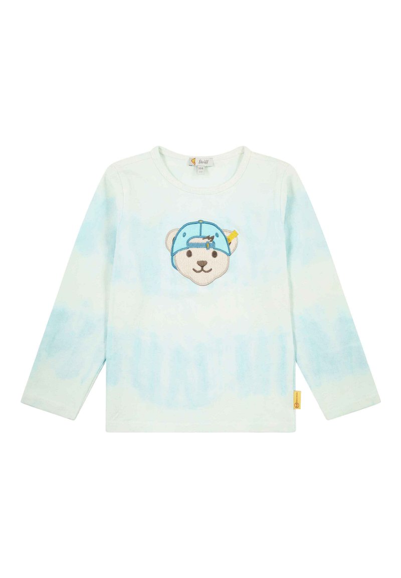 Camisa de manga larga en tie-dye azul claro, con una cara de oso bordada con una gorra azul en la parte delantera. Fabricada en algodón con un corte holgado.