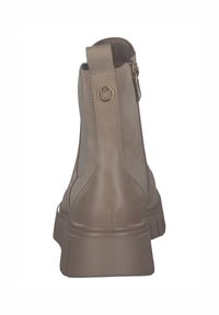 Bottine en cuir marron avec un talon épais, fermeture éclair latérale et détail en accent rond. Texture lisse et design épuré avec un minimum de coutures.
