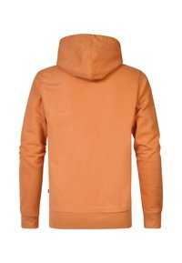 Felpa con cappuccio arancione, realizzata in cotone. Presenta una texture liscia, maniche lunghe e un cordino regolabile sul cappuccio.