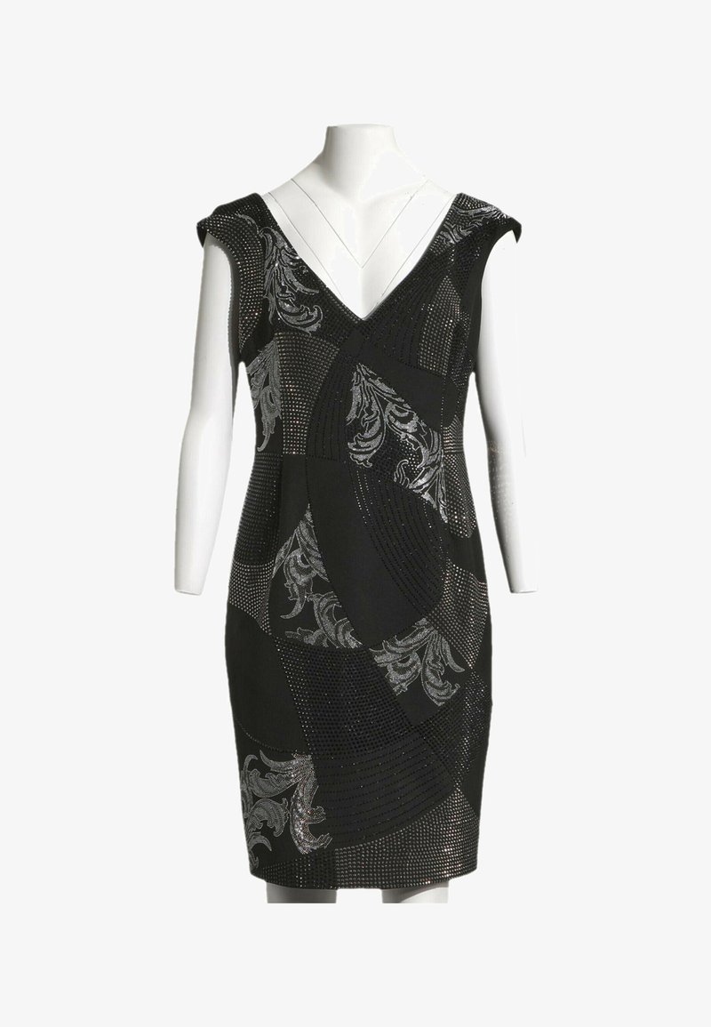 Robe noire jusqu'aux genoux avec col en V, manches courtes et motifs abstraits floraux et ponctués argentés sur un mannequin.