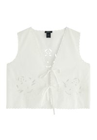 Top corto bianco con scollatura a V, bordi a scallop e ricami floreali. Presenta una chiusura con lacci sul davanti e dettagli intagliati intricati.