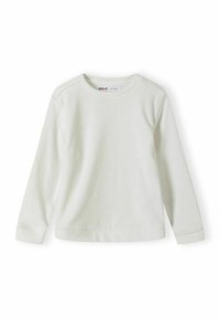 Chemise blanche à manches longues en tissu côtelé, avec un motif étoile discret, col rond et ourlet droit.