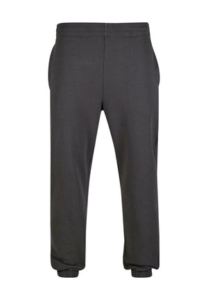 Donkergrijze trainingsbroek van zacht materiaal, met een elastische tailleband, zijzakken en elastische boorden bij de enkels.