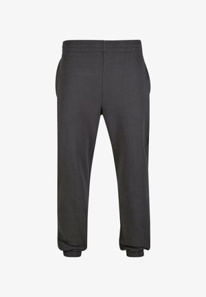 Pantalones de chándal de color gris oscuro, hechos de una tela suave, con una cinturilla elástica, bolsillos laterales y puños elásticos en los tobillos.