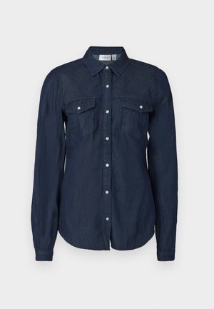 Sötétkék gombos ing könnyű anyagból, két elülső zsebbel, hosszú ujjal és klasszikus gallérral, ívelt hemmel.