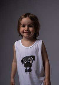 White sleeveless shirt made of cotton with a large cartoon dog graphic featuring gray tones and big, expressive eyes on the front.