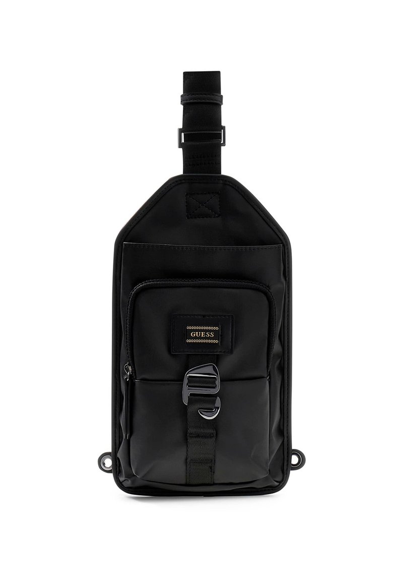 Borsa a tracolla nera in nylon con forma rettangolare, tasca frontale con zip, tracolla regolabile e patch con logo dorato. Texture liscia, design minimalista.