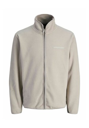 Helle beige Fleecejacke mit hohem Kragen, durchgehendem Reißverschluss und einem horizontalen Akzent auf der Brust. Glatte Textur und lässiges Design.