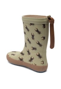 Botte de pluie en caoutchouc beige avec motif de scarabée marron, semelle texturée marron clair et languette marron fixée à l'arrière.