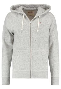 Ljusgrå zip-up hoodie med dragsko, framfickor och en liten mörkröd logotyp på vänster bröst, märkt Hollister storlek medium.