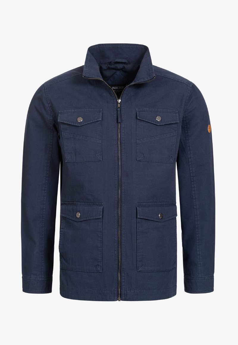 Navy blue men's casual jacket with front zipper, four buttoned flap pockets, and a stand collar.