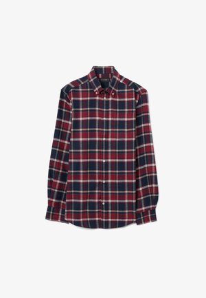 Camicia a maniche lunghe con bottoni in motivo scozzese rosso, blu navy e bianco. Tessuto di cotone, orlo dritto, colletto classico e chiusura con bottoni.