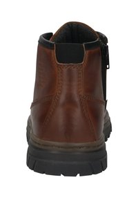 Braune Leder-Ankle Boots mit schwarzem gepolstertem Schaft, elastischem Ziehband hinten, seitlichem Reißverschluss und dicker schwarzer Gummisohle.