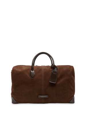 Soft brown leather travel bag with dark brown handles, corner protectors, and a hanging leather tag.
