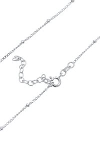 Zilveren ketting met een schakelsystemen van ronde kleine kralen. Voorzien van een ronde karabijnhaak en een verstelbaar ontwerp voor de lengte.