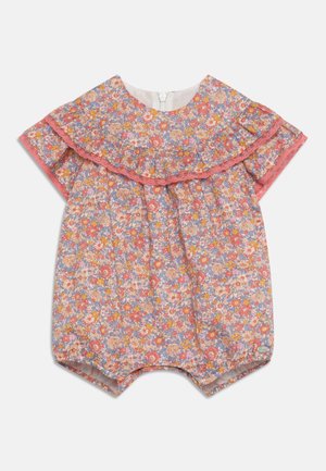 Floraler Jumpsuit in Pastellfarben mit volantbesetztem Kragen und kurzen Ärmeln. Hergestellt aus leichtem Baumwollstoff mit elastischen Beinausschnitten.