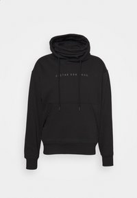 Schwarzer Kapuzenpullover aus dickem Stoff. Verfügt über einen hohen Kragen, eine Kängurutasche und Zugbänder. Schlichte, minimalistische Markenkennzeichnung auf der Vorderseite.