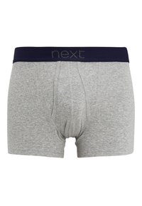 Boxers en coton gris avec une ceinture élastique bleue marine portant le mot "next" en texte gris. Le design comprend une poche à l'avant et des détails de couture.