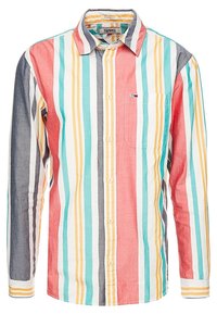 Camicia con bottoni caratterizzata da righe verticali in rosso, blu, giallo e bianco. Materiale in cotone con taschino sul petto e maniche lunghe.