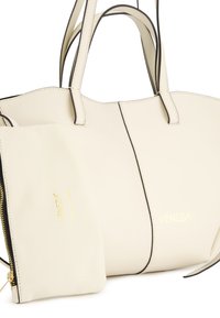 Cream leather tote bag with black accents and gold logo, featuring two handles and an included matching pouch with zip closure.