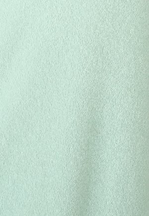 Licht mintgroene stof met een zachte, textuurachtige oppervlakte en een fijne, pluizige weving, geschikt voor kleding of huishoudtextiel.