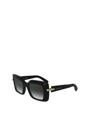 Czarne, oversize okulary przeciwsłoneczne z gradientowymi soczewkami. Oprawa ma matowe wykończenie i złote akcenty. Logo umieszczone na zauszniku.